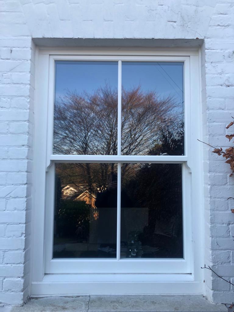 sash windows and white brick